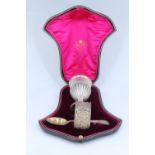 A late Victorian cased silver egg cup, spoon and napkin ring set, Goldsmith's and Silversmith's