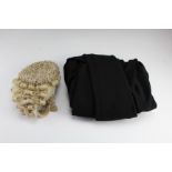 A vintage barrister's wig and gown by 'Ravenscroft' and 'Ede and Ravenscroft' respectively, wig size