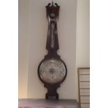 A Victorian mahogany banjo barometer by 'Jos. Walker, Workington', having silvered dials, the