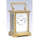 An early 20th Century brass carriage clock, retailed by 'Pearce and Sons Ltd, Leeds, York and