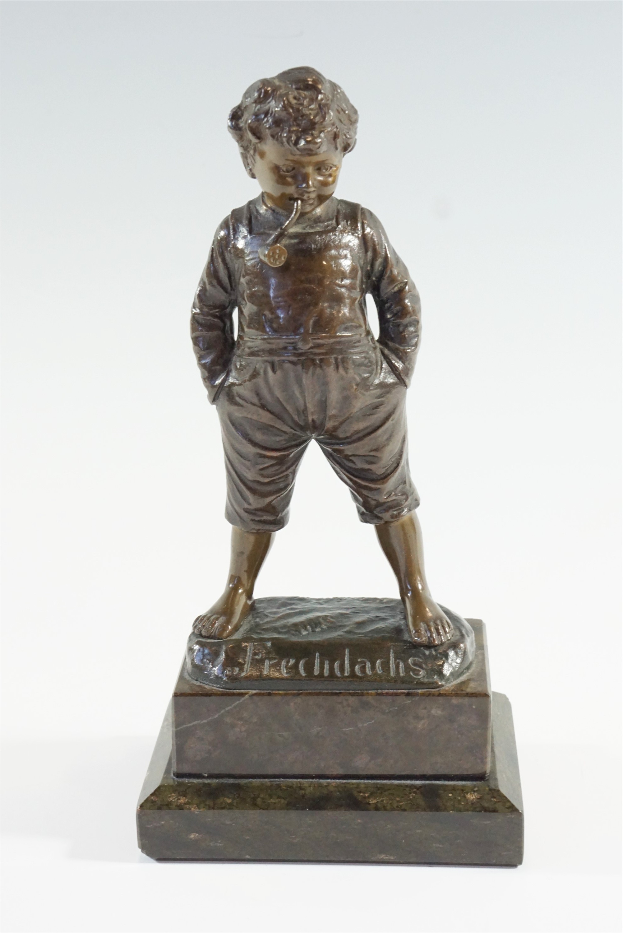 After R Hobold (German, 19th Century) "Frechdachs", [cheeky monkey], a cast bronze figure of a young