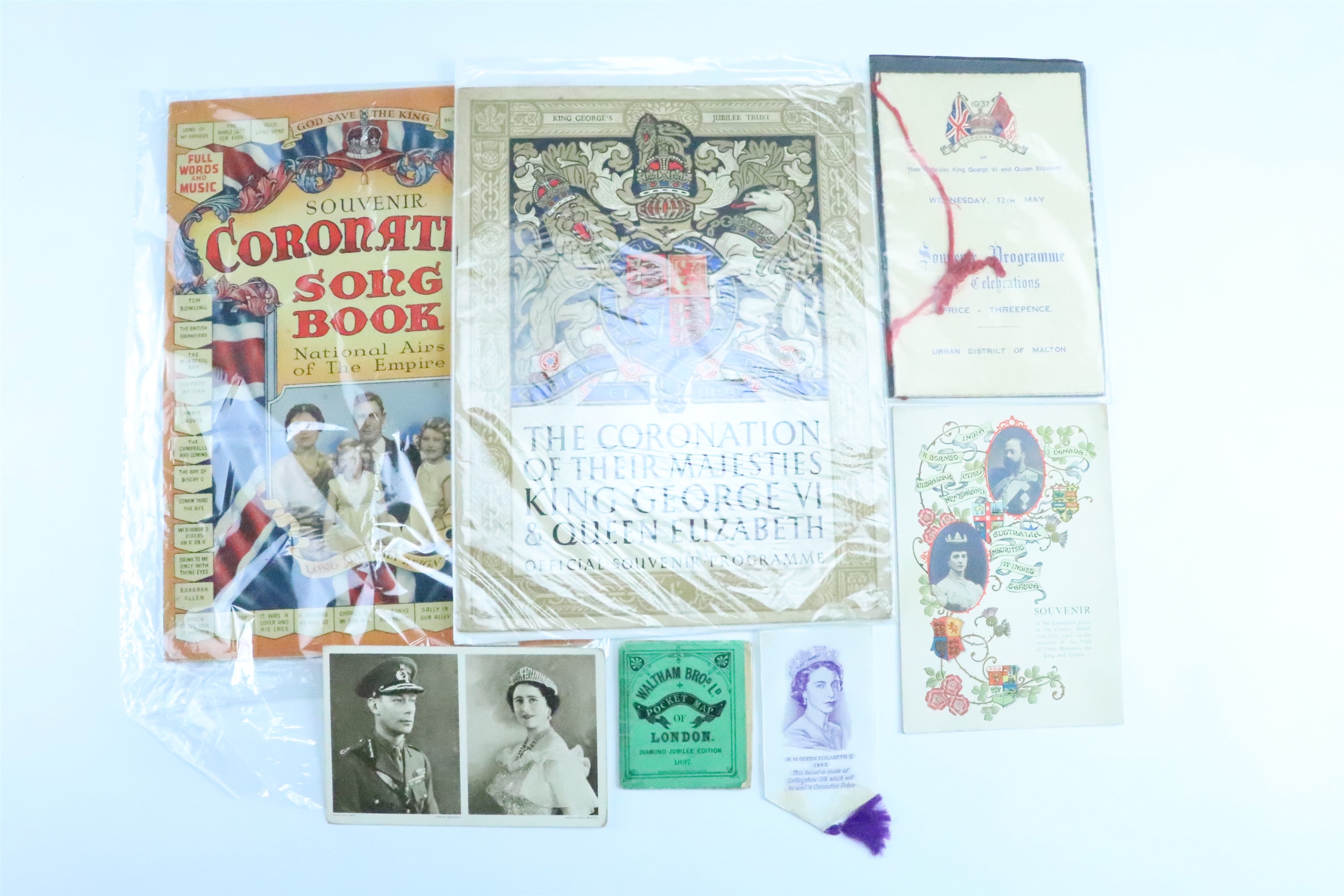 A small group of royal commemorative publications together with a 1953 Coronation commemorative
