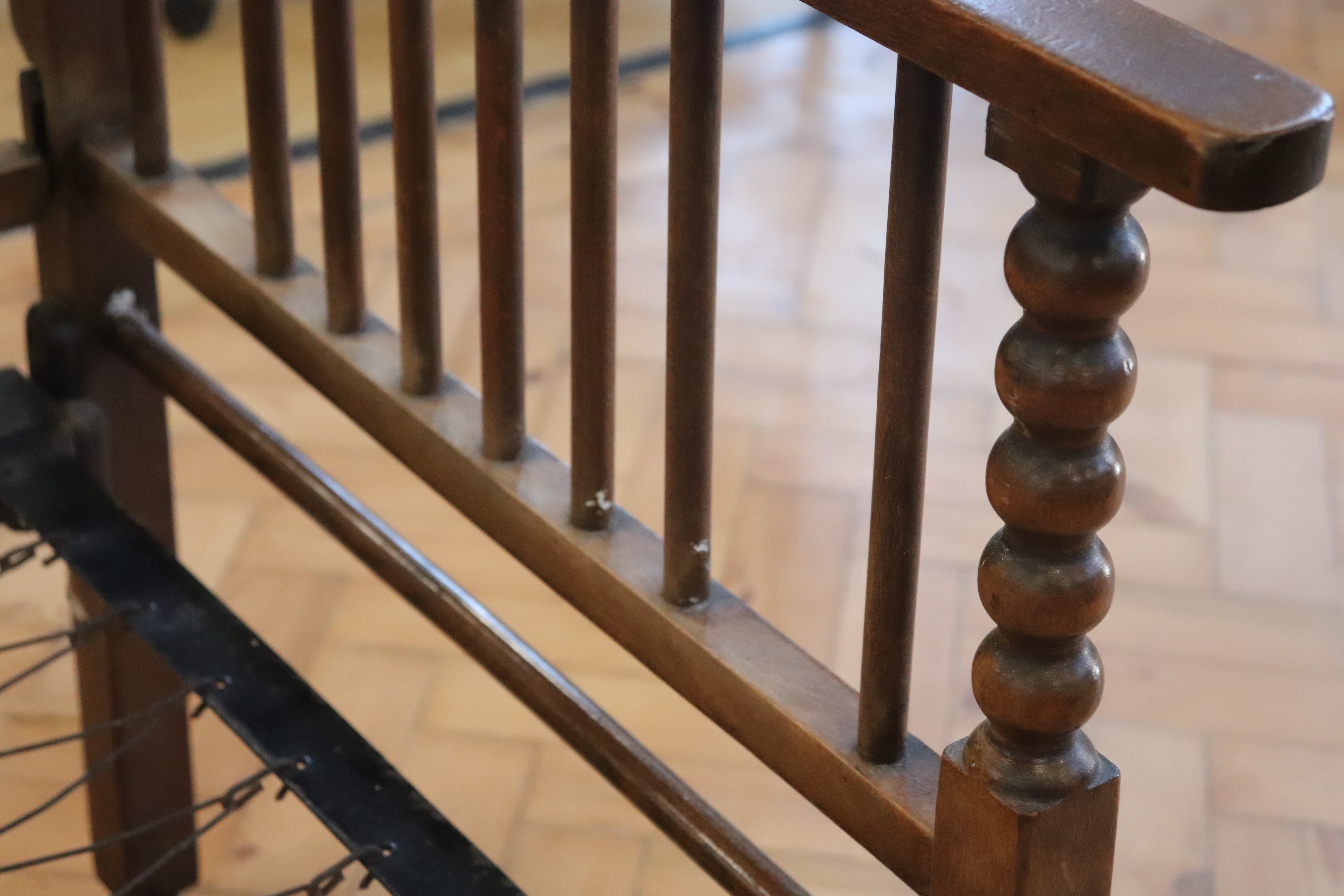 An early 20th Century folding sprung-iron-framed turned wood day bed, (some insect damage) - Image 3 of 3