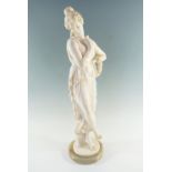 A late 20th Century figurine of a classical lady on an onyx base, 68 cm