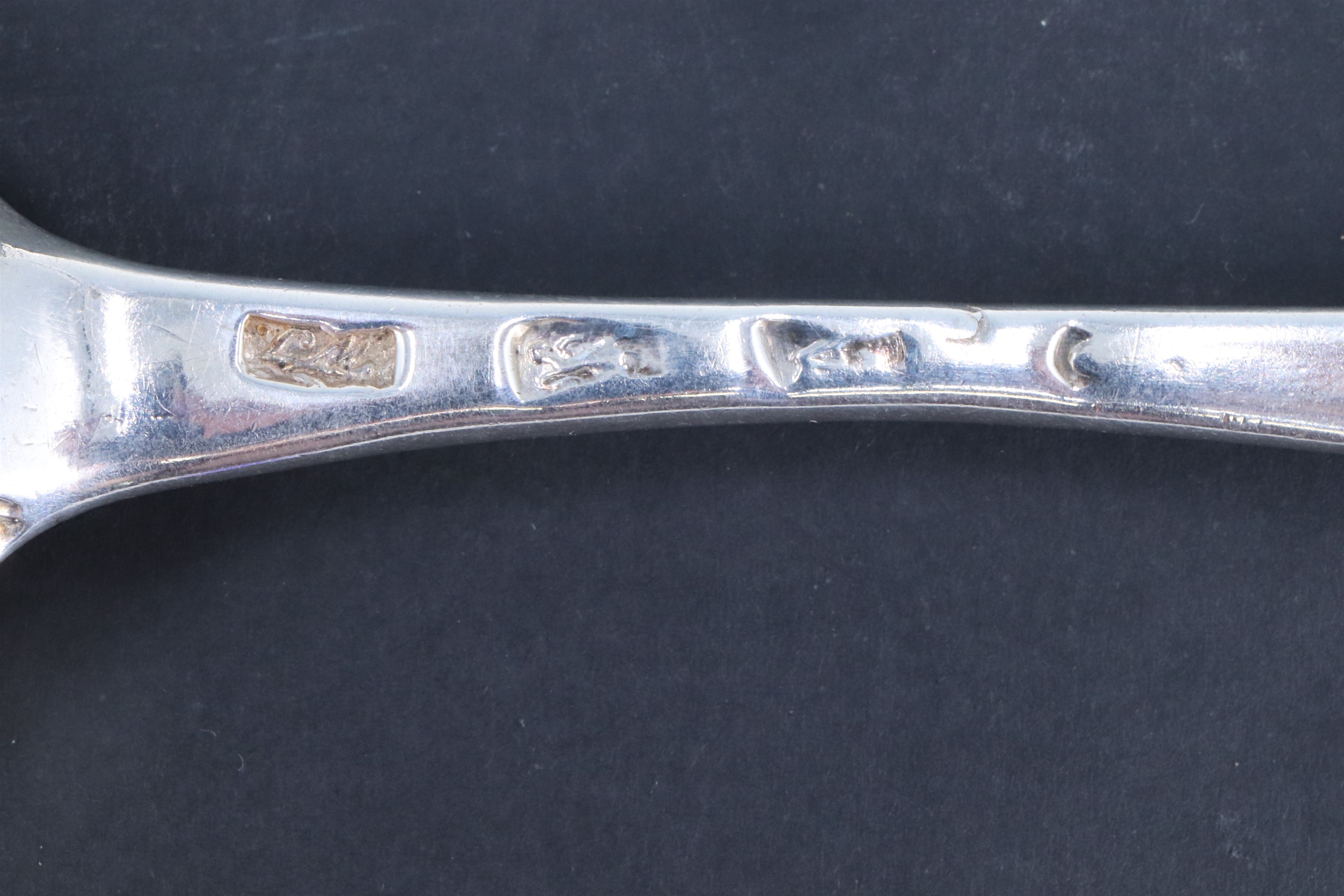 A set of four George IV silver Old English pattern table spoons, bearing engraved crests to the - Image 2 of 3