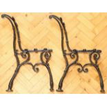 A pair of Victorian cast iron bench ends, 78 cm high