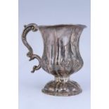 A William IV silver Christening cup, of waisted and lobed from, having an acanthus-capped compound