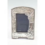 A silver faced golf theme photograph frame, London, 1987, 21 x 14.5 cm overall (12 x 8 cm sight