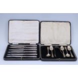 A cased set of 1950s silver-handled tea knives together with a cased set of 1920s silver tea