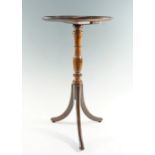 A reproduction diminutive mahogany tripod wine or lamp table, 30 cm x 56 cm