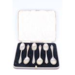 A cased set of 1930s silver tea / coffee spoons, each having reeded stem and anthemion-like