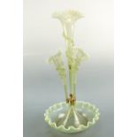 An opaline glass epergne, the trumpet flutes having crinoline rims and applied trail decoration,