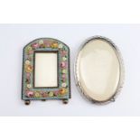 A diminutive micro-mosaic floral pattern photograph frame together with a pierced electroplated oval