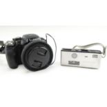 A Minolta 16 Model P camera together with a Lumix Panasonic DMC-FZ62 digital camera