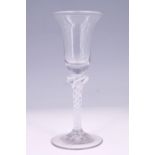 A mid-18th Century style opaque twist stem wine glass, having a bell-shaped bowl with basal knop,