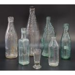 A group of glass bottles, including D D Underwood & Sons of Maryport, W Underwood of Carlisle,