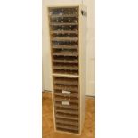 A late 20th Century 19 drawer storage unit, the plywood drawers having clear plastic fronts,