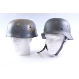 A German Third Reich Model 1940 steel helmet, stamped EF64, (later liner), together with a