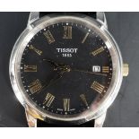 A Tissot 1853 quartz wristwatch, model T033410A, having a black face with date aperture, gilt