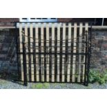 A reproduction Victorian brass and iron double bedstead