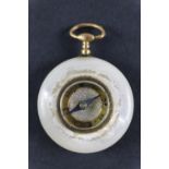 A Victorian gilt metal mounted mother-of-pearl fob compass, having a hand painted dial, 25 mm
