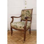 A late Victorian upholstered mahogany open armchair