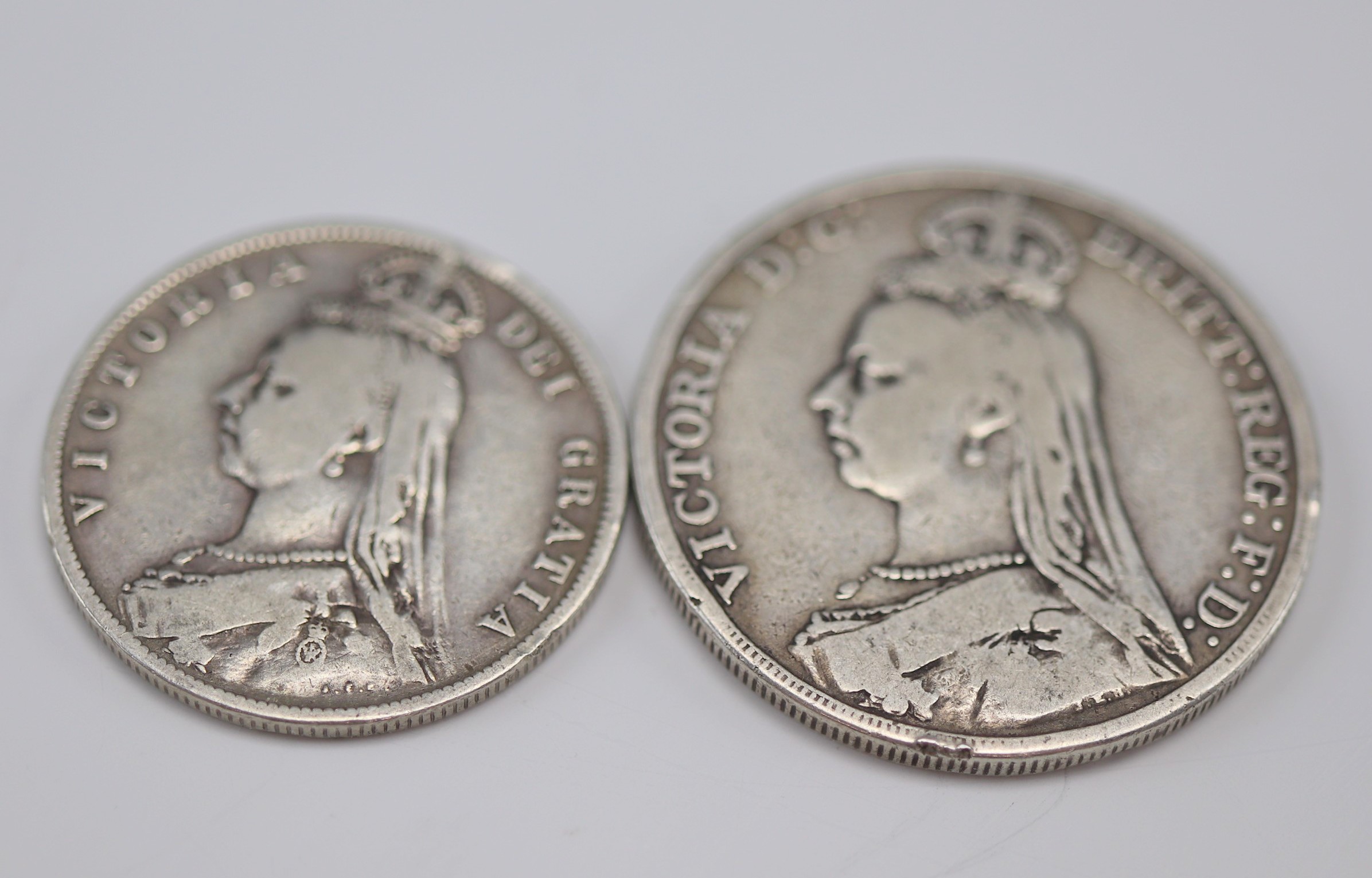A Victorian 1889 silver crown coin together with an 1888 half-crown