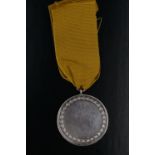 An early 20th Century Royal East Kent Regiment regimental white metal medal, (tested as silver),