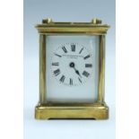 An early-to-mid 20th Century brass carriage clock, the dial marked 'John Bradshaw and Sons,