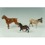 A Beswick boxer dog,(a/f) together with a donkey and a pony, boxer 14 cm