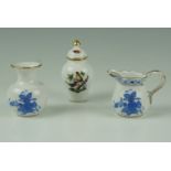Three items of Herend porcelain, comprising a blue-and-white jug and vase, and a polychrome lidded