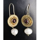 A pair of pearl, almandine and silver-gilt ear pendants, each comprising a circular cabochon