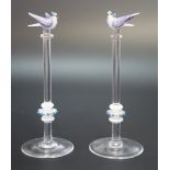 A pair of glass lampwork ornaments in the form of birds perched atop knopped columns, 13.5 cm (one