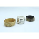Two late 19th / early 20th Century horn napkin rings together with an electroplate ring decorated