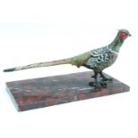 An Austrian cold painted bronze figure of a pheasant, on a later variegated rouge marble base,