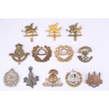 A collection of British army territorial battalion cap badges