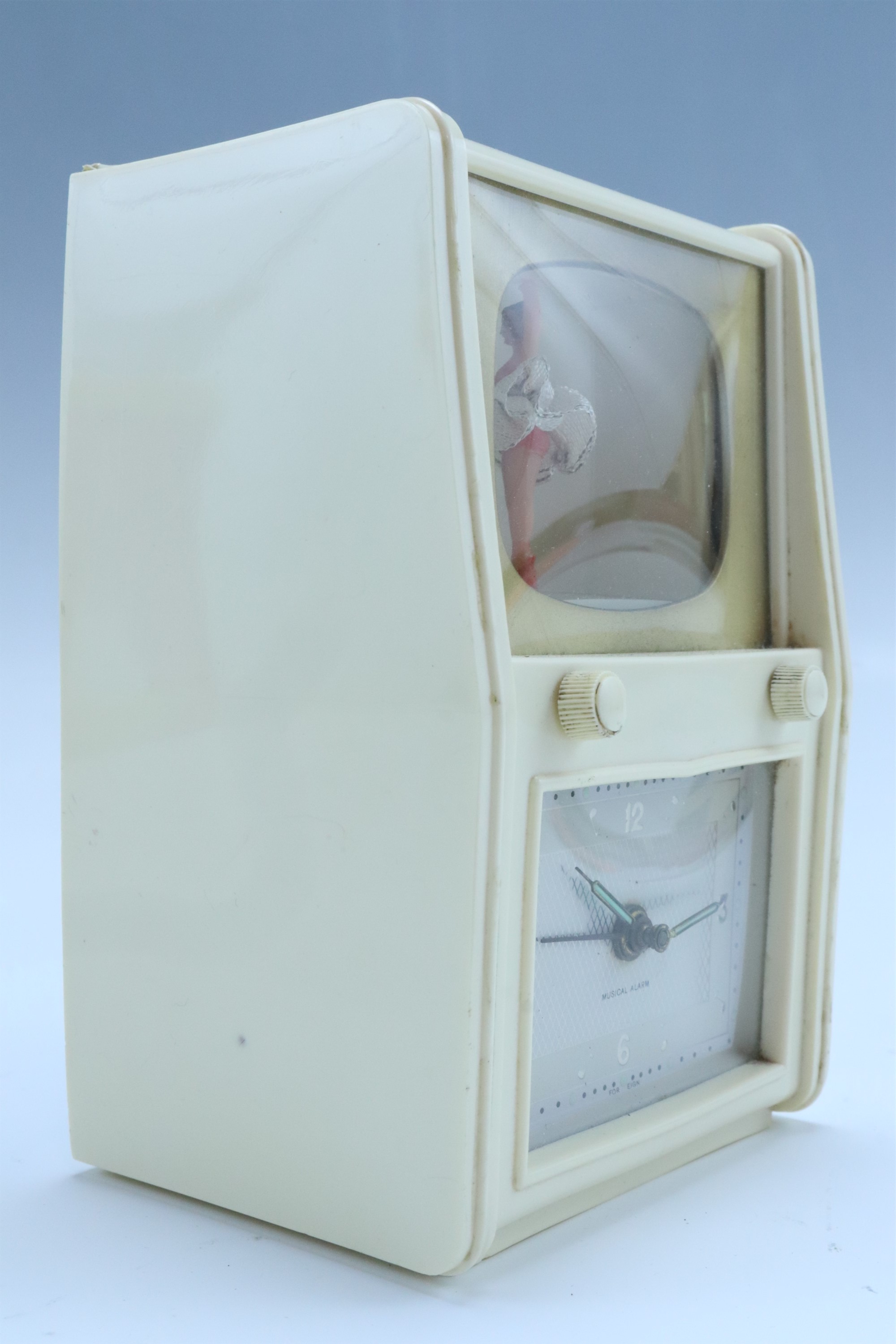 A German kitsch automaton musical alarm clock, having an ivory coloured composition case modelled as - Image 2 of 2