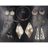 A quantity of white metal jewellery including earrings, an ankh bracelet, terrier dog brooch, etc