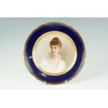 A portrait cabinet plate by Franz Xaver Thallmaier, portraying a well-to-do young woman with quaffed