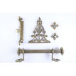 A Victorian brass towel rail, a sprung clip and various brass ornaments
