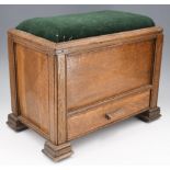 A George V oak shoe polishing or similar box stool, having an upholstered hinged lid and base