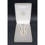 A late 20th Century cultured pearl princess-length necklace, the knotted string of 8 mm pearls