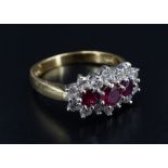 A ruby and diamond triple-cluster ring, the largest, central ruby of approx .33 ct, the brilliant-