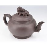 A Chinese Yixing stoneware teapot, impressed character marks to the base, 15 cm
