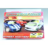 Two boxed Micro Scalextric sets, comprising F1 "Vodafone McLaren Mercedes" and "Street Mayhem"