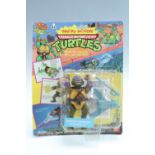 A sealed Teenage Mutant (Ninja) Hero Turtles "Sewer-Swimmin' Donatello" motorised action figure,