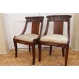 A pair of Regency brass mounted mahogany stand / dining chairs, 79 cm high