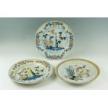 Three late 17th / early 18th century polychrome tin-glazed earthenware chargers, 34.5 cm