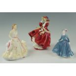 A Royal Doulton figurine, Top O' The Hill, together with Coalport and one other, 18 cm tallest