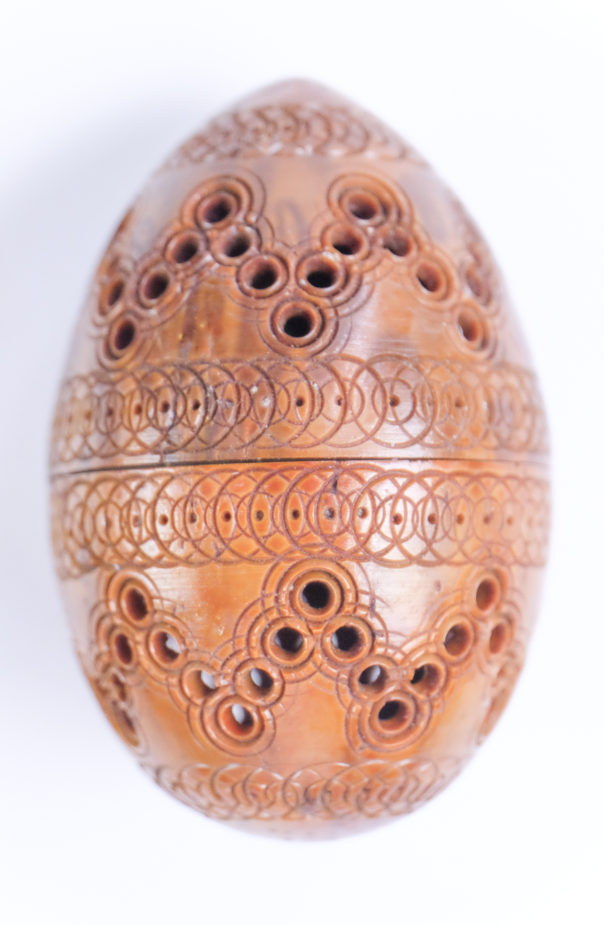 A late 18th / early 19th Century turned and pierced coquilla nut pocket pomander, 4 x 6 cm